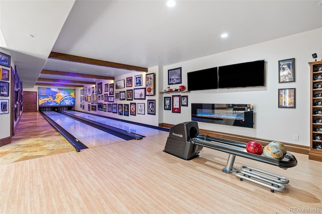 exercise room with a bowling alley and recessed lighting