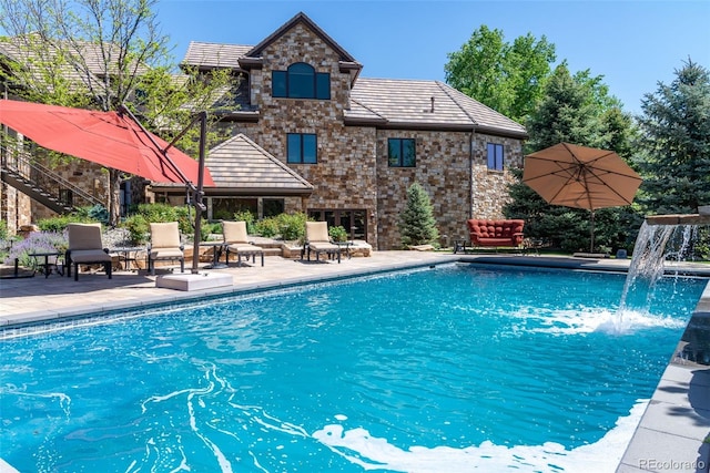 outdoor pool featuring a patio