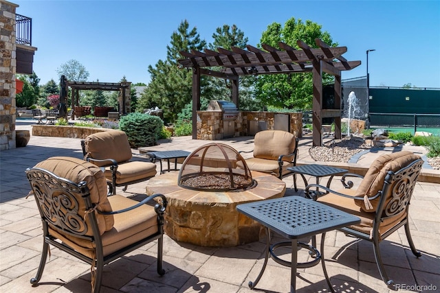 view of patio featuring a pergola, a fire pit, and area for grilling