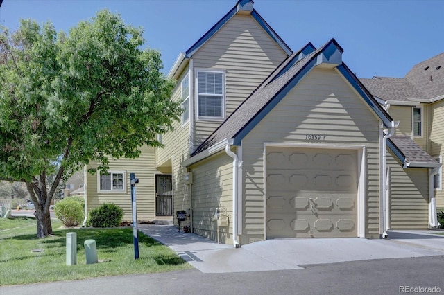 10359 W Fair Ave Unit F, Littleton, CO 80127 - townhome / multi-family property with an attached garage and a front lawn