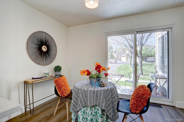 10359 W Fair Ave Unit F, Littleton, CO 80127 - dining space with wood finished floors