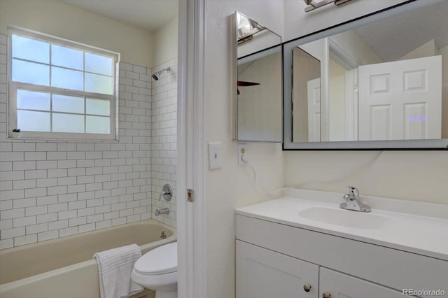 10359 W Fair Ave Unit F, Littleton, CO 80127 - full bathroom featuring washtub / shower combination, toilet, and vanity