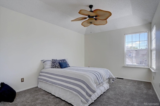 10359 W Fair Ave Unit F, Littleton, CO 80127 - carpeted bedroom featuring baseboards, a textured ceiling, and a ceiling fan