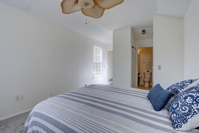 10359 W Fair Ave Unit F, Littleton, CO 80127 - carpeted bedroom featuring ensuite bath, a ceiling fan, baseboards, and a textured ceiling