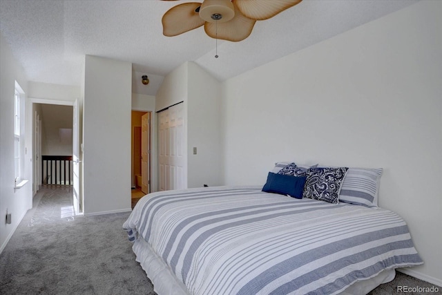 10359 W Fair Ave Unit F, Littleton, CO 80127 - bedroom with carpet floors, baseboards, a ceiling fan, a closet, and lofted ceiling