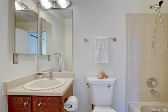 10359 W Fair Ave Unit F, Littleton, CO 80127 - bathroom featuring toilet, vanity, and  shower combination