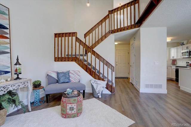 10359 W Fair Ave Unit F, Littleton, CO 80127 - living area with wood finished floors and stairs