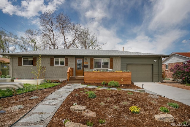 4655 Ludlow St, Boulder, CO 80305 - ranch-style home with driveway, brick siding, and a garage
