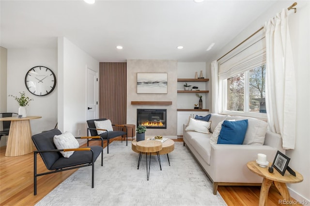 4655 Ludlow St, Boulder, CO 80305 - living room featuring recessed lighting, a glass covered fireplace, and light wood-style flooring