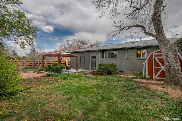4655 Ludlow St, Boulder, CO 80305 - back of house featuring a gazebo, fence, brick siding, a shed, and a patio