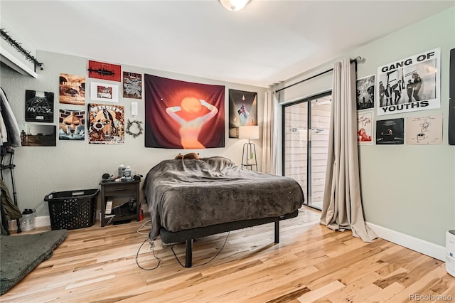 6213 Willow Ln, Boulder, CO 80301 - bedroom featuring wood finished floors and access to outside