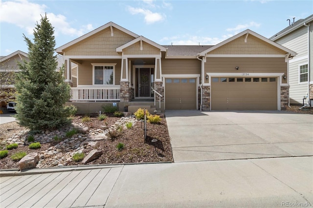 2724 Rising Moon Way, Castle Rock, CO 80109 - craftsman-style house with an attached garage, concrete driveway, covered porch, and stone siding