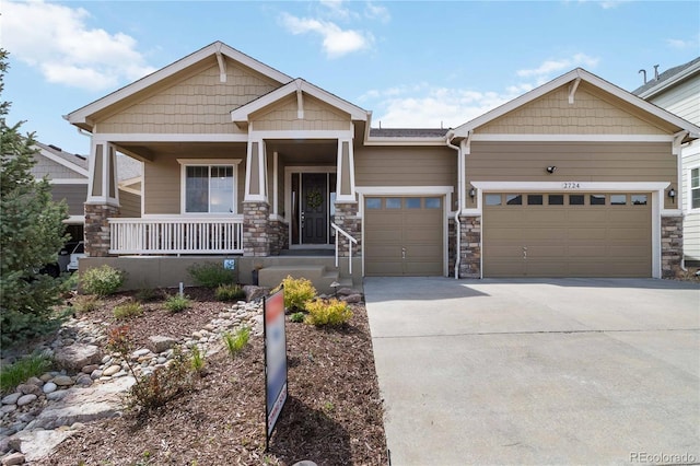 2724 Rising Moon Way, Castle Rock, CO 80109 - craftsman-style home featuring a porch, driveway, an attached garage, and stone siding