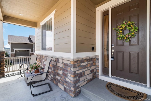 2724 Rising Moon Way, Castle Rock, CO 80109 - entrance to property with a porch, stone siding, and a garage