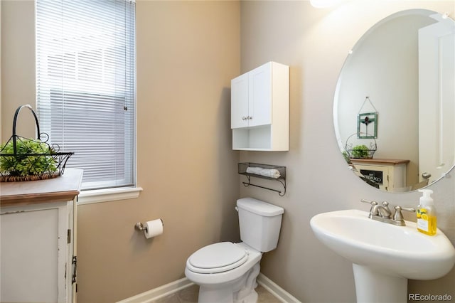 2724 Rising Moon Way, Castle Rock, CO 80109 - half bath featuring baseboards, toilet, and a sink