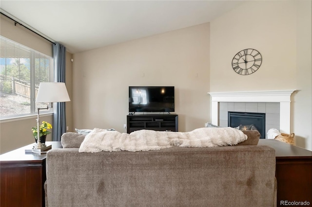 2724 Rising Moon Way, Castle Rock, CO 80109 - living room with vaulted ceiling and a tile fireplace