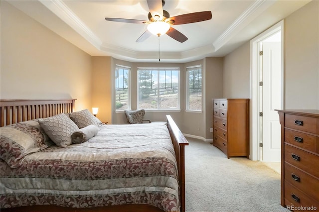 2724 Rising Moon Way, Castle Rock, CO 80109 - bedroom featuring a raised ceiling, light colored carpet, crown molding, baseboards, and a ceiling fan