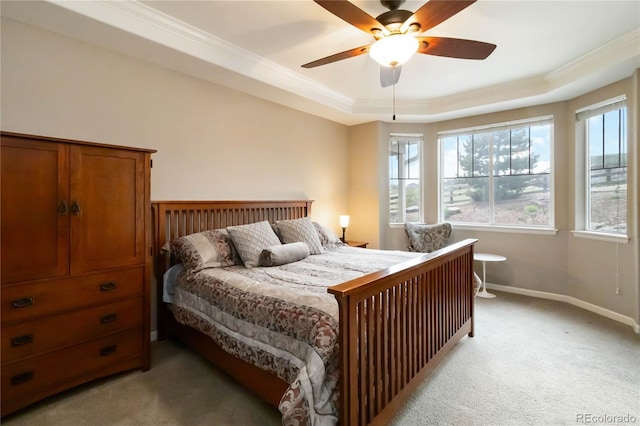 2724 Rising Moon Way, Castle Rock, CO 80109 - bedroom featuring light colored carpet, ornamental molding, a tray ceiling, baseboards, and ceiling fan
