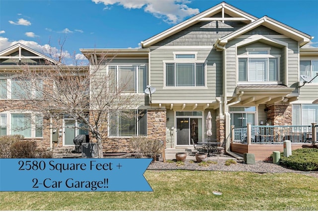 15064 E Crestridge Dr, Centennial, CO 80015 - townhome / multi-family property featuring stone siding and a front yard