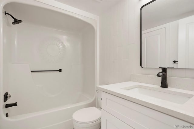 full bathroom featuring vanity, shower / bath combination, and toilet