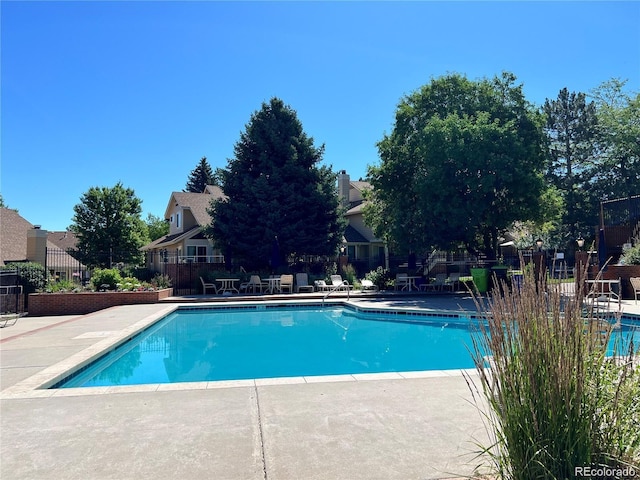 view of swimming pool with a patio area