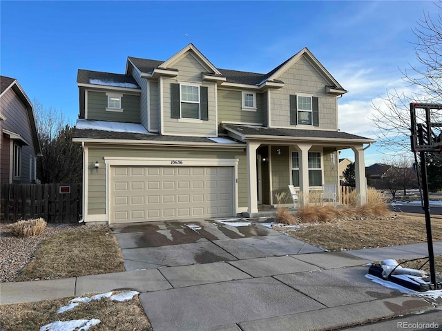 view of front of property with a porch and a garage