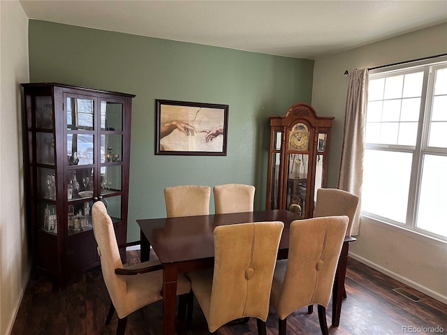 10636 Racine Cir, Commerce City, CO 80022 - dining space featuring dark wood-type flooring