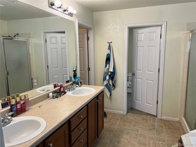 10636 Racine Cir, Commerce City, CO 80022 - bathroom with an enclosed shower and vanity