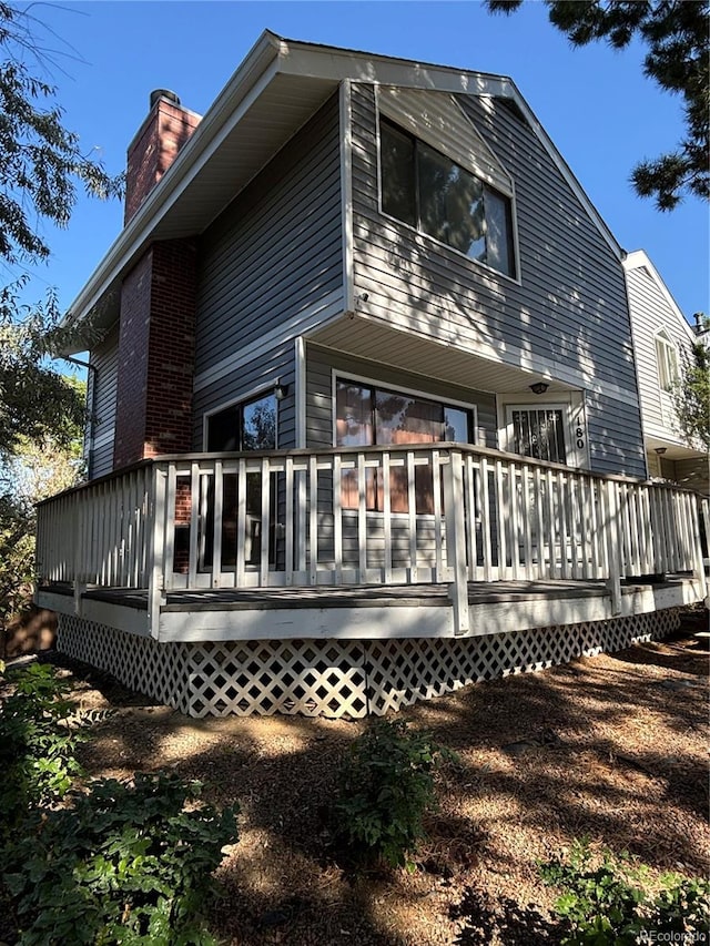 rear view of property with a deck