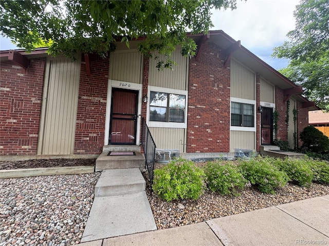 7020 W Portland Ave, Littleton, CO 80128 - view of exterior entry featuring brick siding
