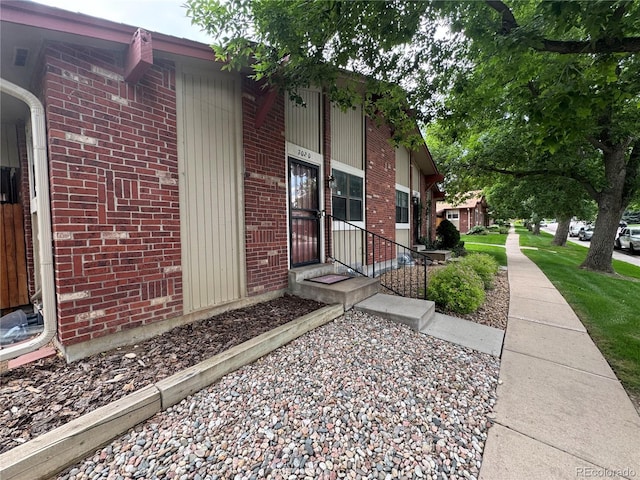 7020 W Portland Ave, Littleton, CO 80128 - view of property exterior featuring brick siding