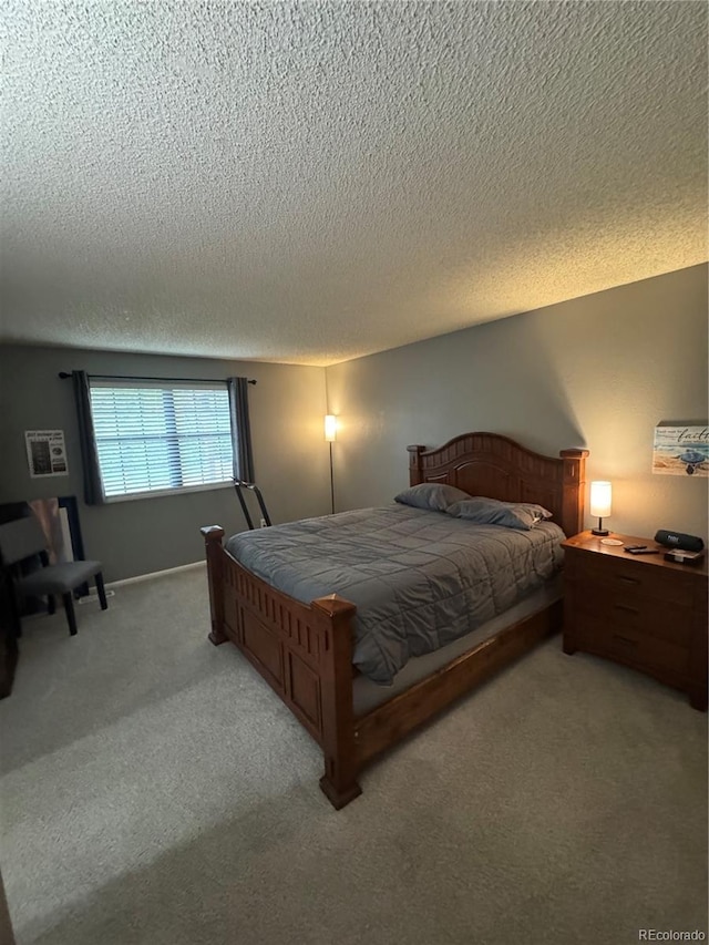 7020 W Portland Ave, Littleton, CO 80128 - bedroom featuring light colored carpet and a textured ceiling