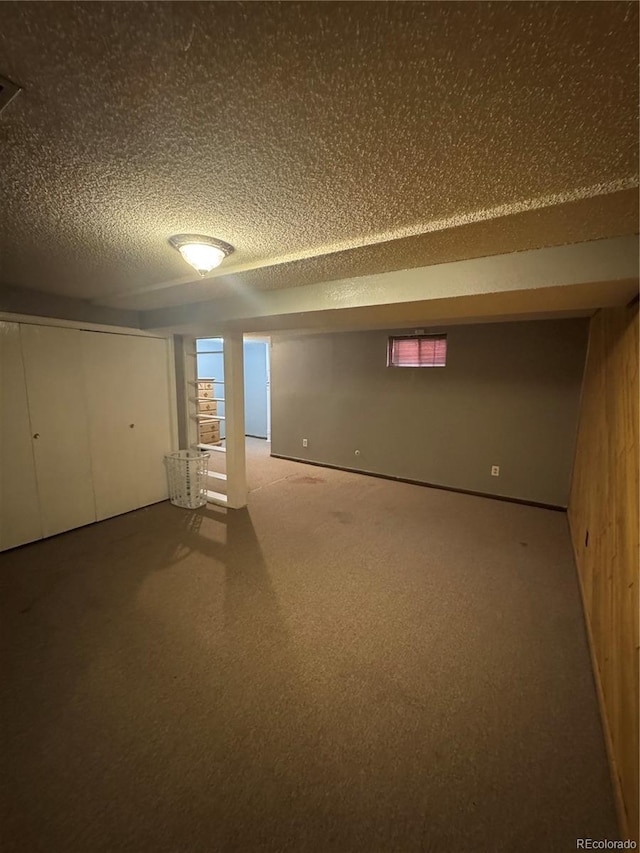 7020 W Portland Ave, Littleton, CO 80128 - finished below grade area with carpet flooring and a textured ceiling