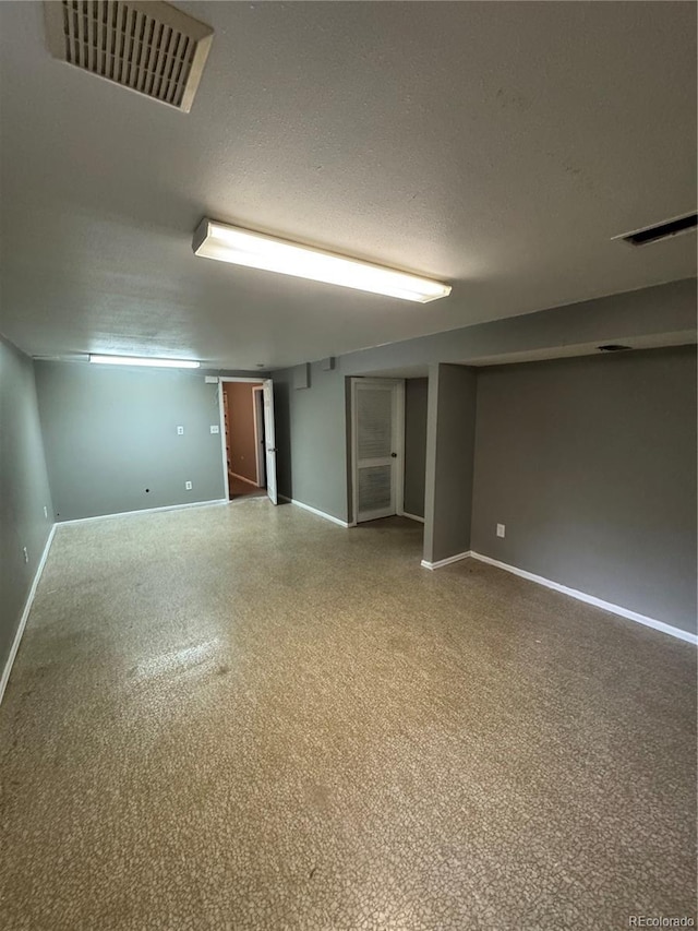 7020 W Portland Ave, Littleton, CO 80128 - unfurnished room with a textured ceiling