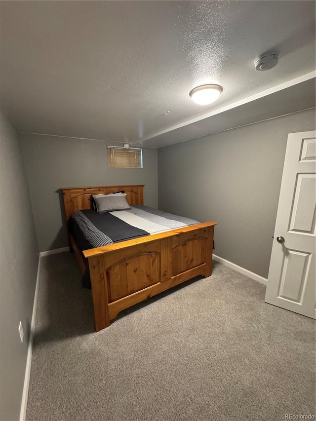 7020 W Portland Ave, Littleton, CO 80128 - bedroom featuring carpet floors and a textured ceiling