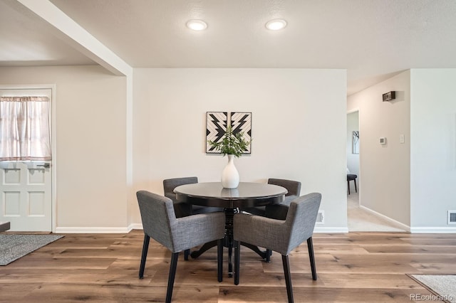 14505 W 52nd Ave, Arvada, CO 80002 - dining area featuring wood finished floors, baseboards, and recessed lighting