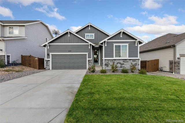 craftsman house with a garage and a front yard