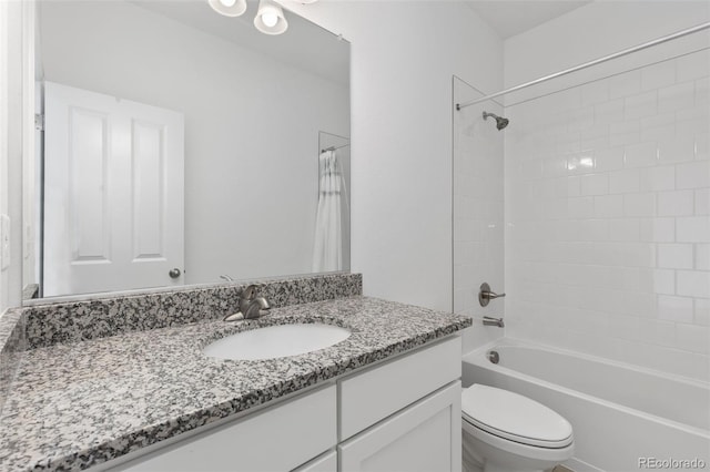 full bathroom with shower / bath combo with shower curtain, vanity, and toilet