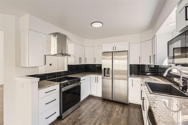 kitchen featuring sink, island range hood, dark hardwood / wood-style flooring, white cabinetry, and stainless steel appliances