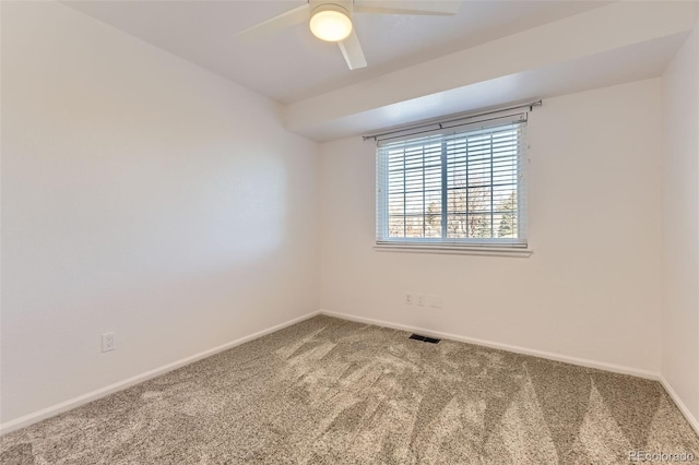 empty room featuring carpet floors and ceiling fan