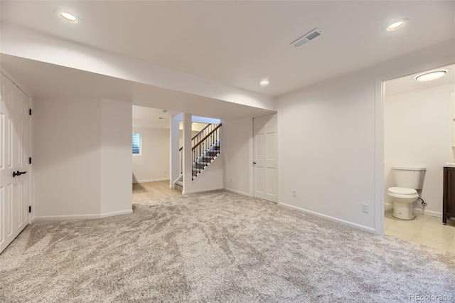 basement with light carpet