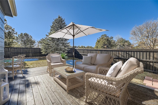 wooden deck featuring outdoor lounge area