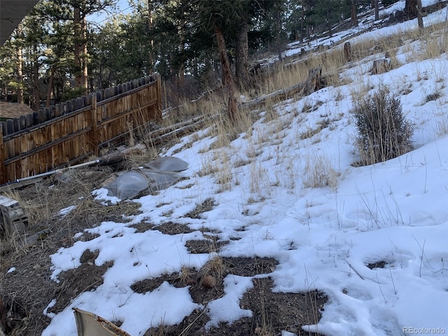 view of yard layered in snow