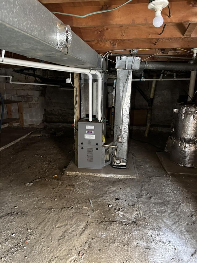 basement featuring heating unit