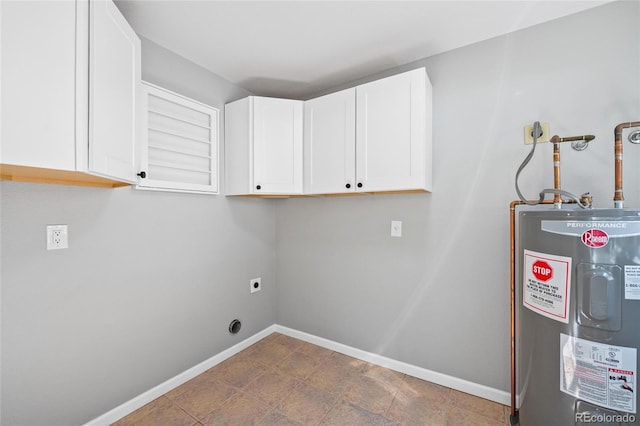 washroom featuring cabinet space, electric dryer hookup, baseboards, and water heater