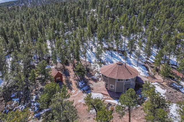 drone / aerial view featuring a forest view