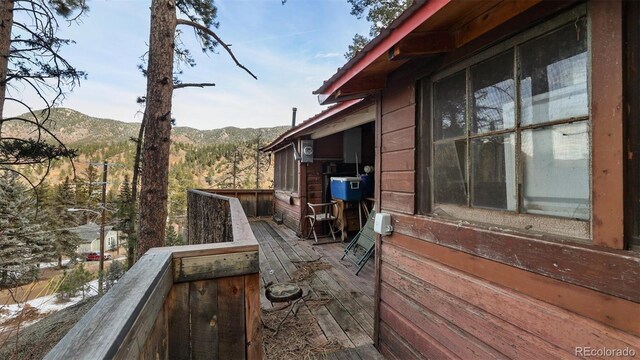 wooden terrace with a mountain view