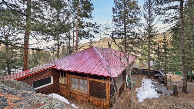 view of home's exterior with a mountain view