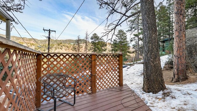 view of snow covered deck