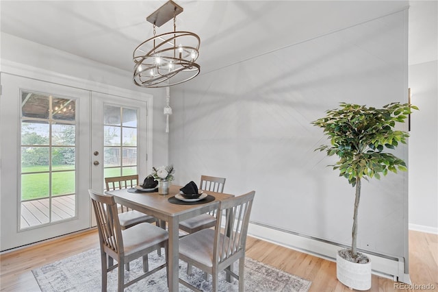 865 S Everett St, Lakewood, CO 80226 - dining space featuring a chandelier, french doors, and light wood finished floors